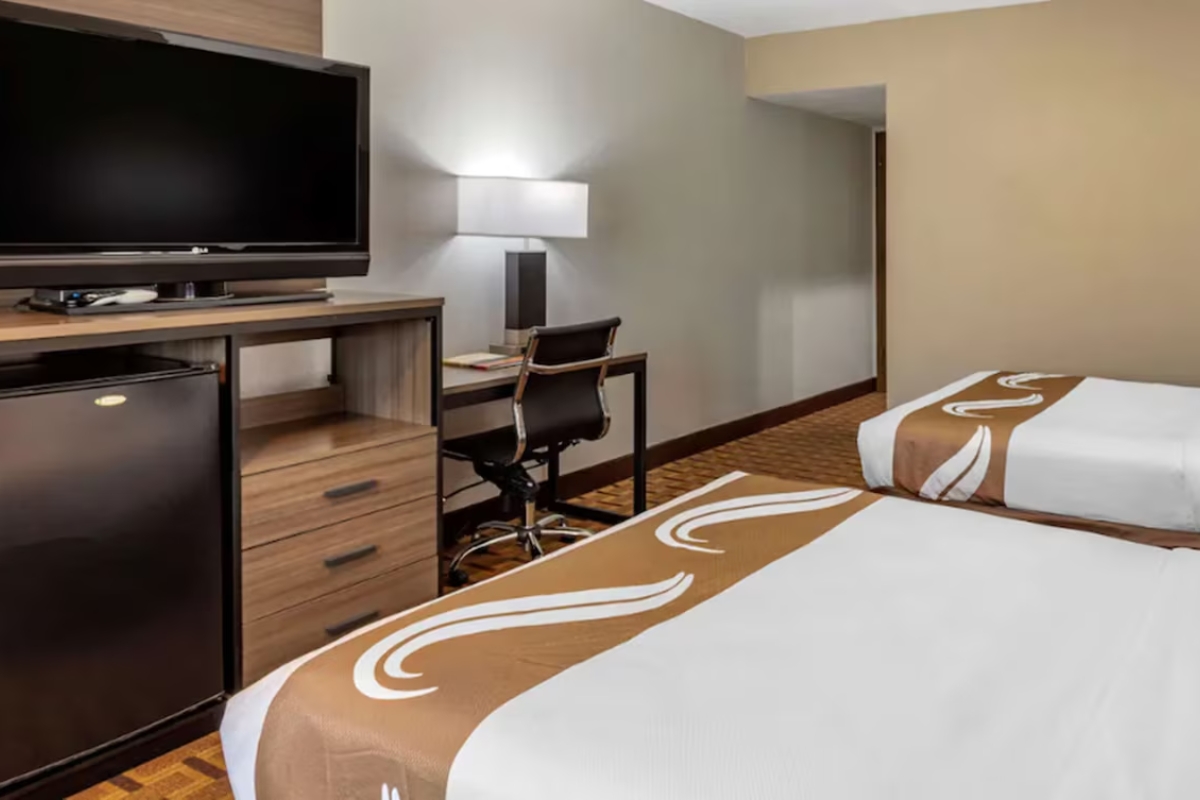 Hotel room with a queen bed